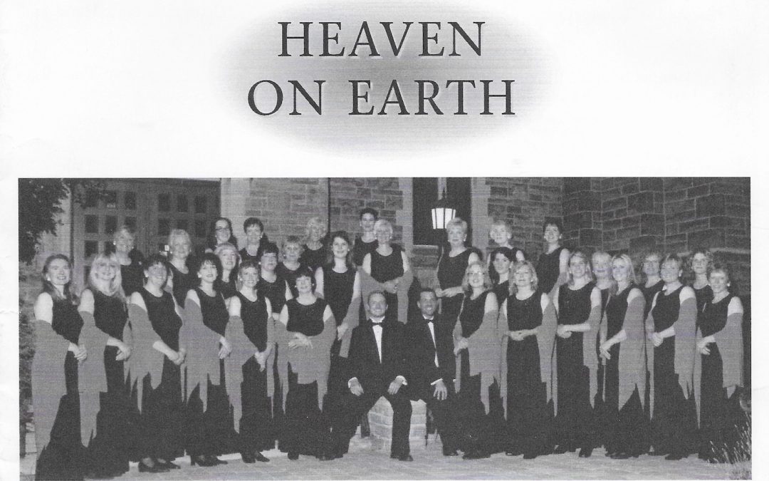A concert programme cover with Oriana in a rose themed logo with the concert title Heaven on Earth and a formal group photo of the choir dressed in performance wear.